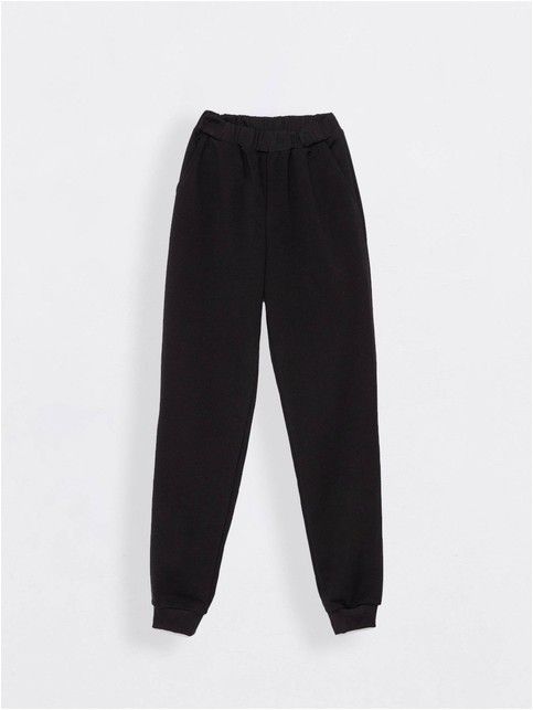 Джоггеры женские ORA с высокой посадкой с легким мерцанием люрекса блестящего черного цвета Джоггеры женские ORA с высокой посадкой с легким мерцанием люрекса блестящего черного цвета - купить в интернет-магазине Conte